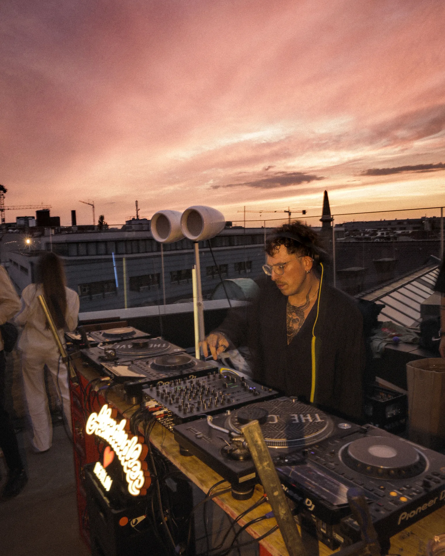 Almdudler rooftop event at sunset